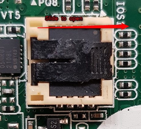 B.	Slide the holder on the chip in the direction of the grooves carefully to open the compartment.